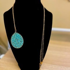 Long necklace with blue beaded charm
